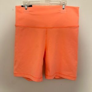 TNA atmosphere short. Nice bright peach ready for vacation. Length 7” size Large